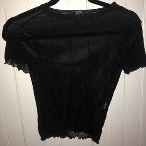 Black sheer top with ruffle details